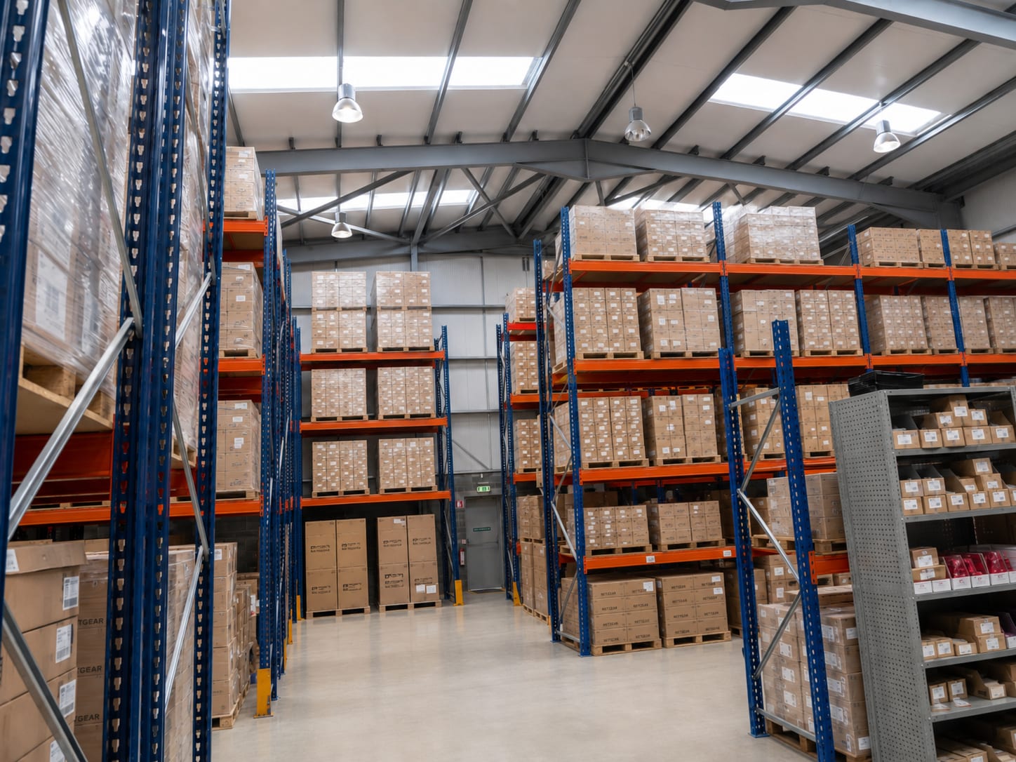 High-bay warehouse with full-height pallet racking and palletised stock